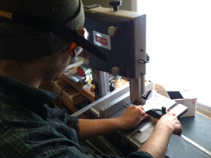 Stu, making cuts into the meticulously machined skeleton "bones" with a bandsaw.