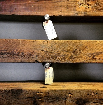 Some gorgeous mantels made from barn lumber at Sangamon Reclaimed. The tags tell customers exactly where they were sourced from and give the date of the original barn's construction.